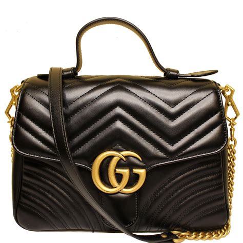 GG Marmont small shoulder bag in black tweed .